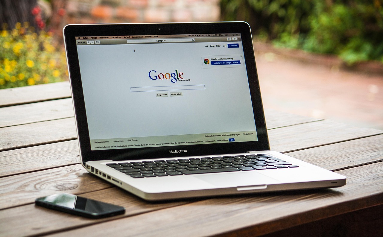 Macbook, laptop, google — AI vs. Human Intelligence: Complementary Forces or Rival Technologies?