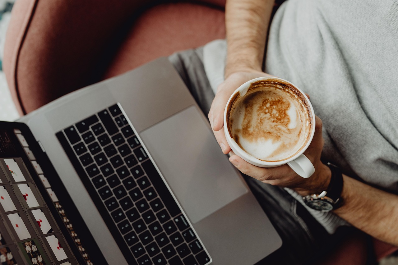 Coffee, cup, computer — Exploring Viking IPTV Options for Live Channels and On-Demand Media