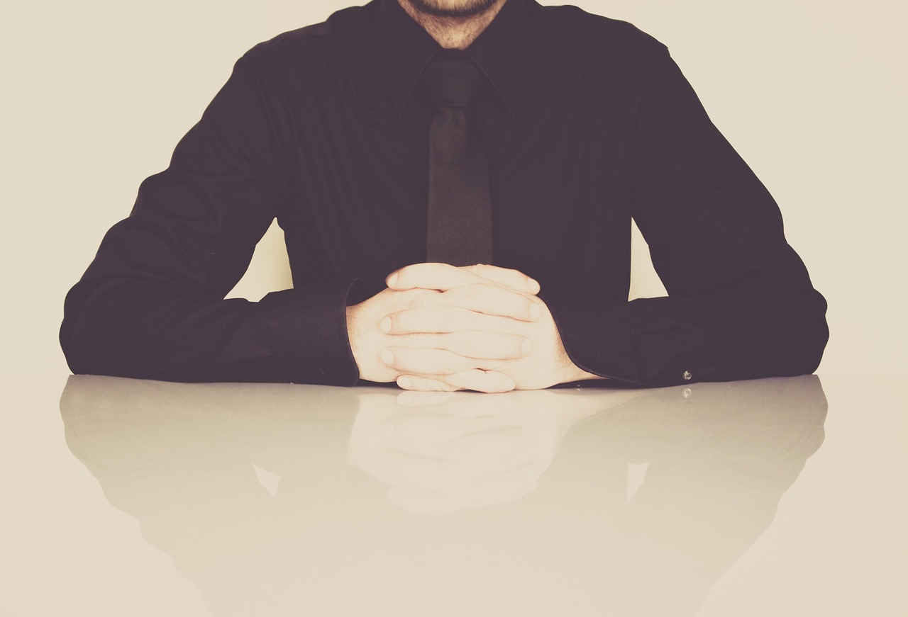 Businessman, office, necktie — Streamlining Verification Processes with TextVerified