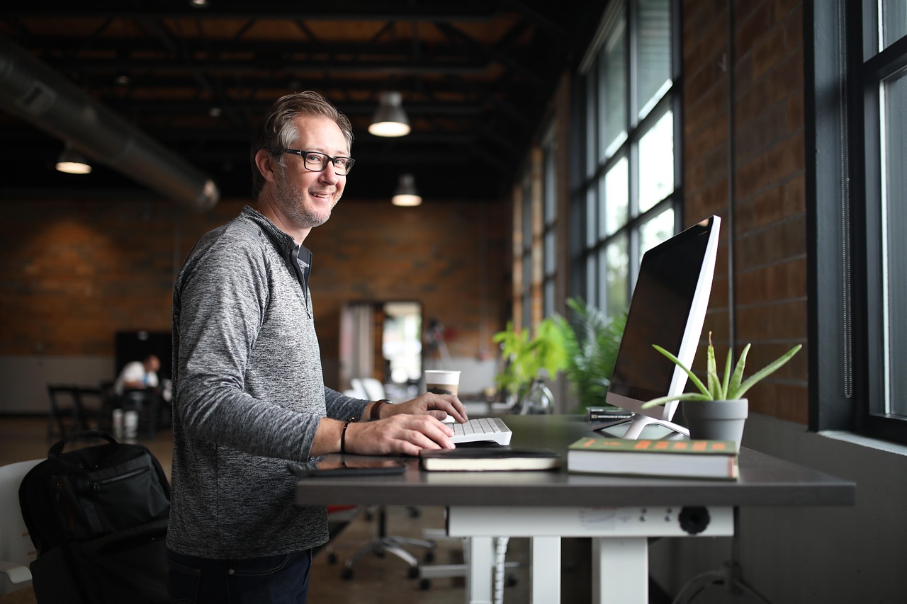 Office desk, man, business — Unleash Cinematic Adventures at Home with Kaleidescape's Complimentary Movie Credits